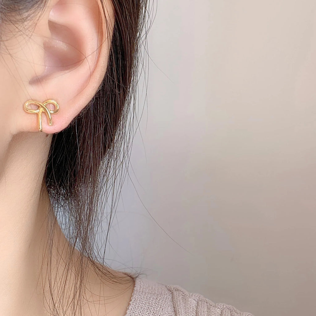 Elegant Minimalist Gold Alloy Ribbon Bow Knot Spiral Stud & Clip On No Piercing Fashion Earrings