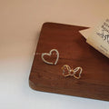 Sweet Copper Asymmetric Bow Heart Stud Earrings With Hollow Micro Pave Zircon