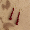 Hepburn Style Red Glass Pearl Tassel Drop Earrings With Copper Geometric Design