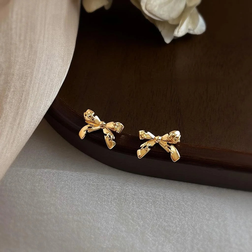 14K Plated Eco-Friendly Copper Bow Stud Earrings With Stitched Crack Design Style