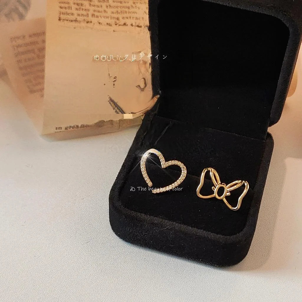 Sweet Copper Asymmetric Bow Heart Stud Earrings With Hollow Micro Pave Zircon