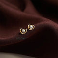 Minimalist Hollow Heart Pearl Stud Earrings With High Luster Pearl And Silver Plated