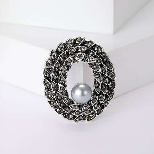 编织椭圆珍珠胸针 shown in product view 1 with visible metal and stone details