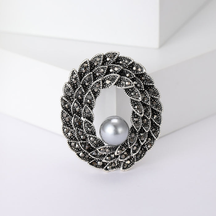 Braided Oval Crystal Brooch With White Pearl Accent