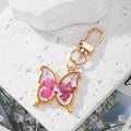 Gold Tone Butterfly and Fishtail Pressed Flower Clip Keychains view 3