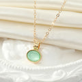 Gold Tone Pale Green Oval Stone Necklace and Huggie Earrings view 4