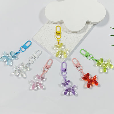 Seven translucent balloon dog clasp charms in assorted colors
