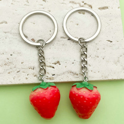 Image 1 showing strawberry key chain - silver.