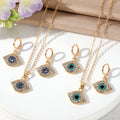 Gold Tone Crystal Evil Eye Necklace and Huggie Earring Options view 1