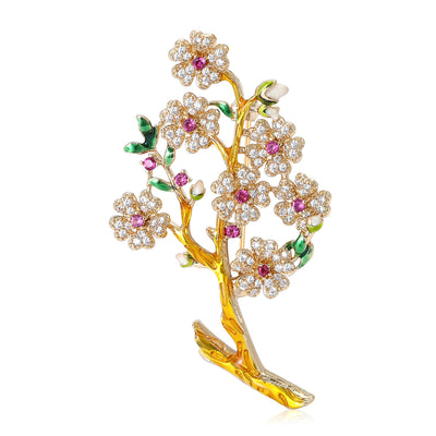 Front view of a gold-tone branch covered with pale pink crystal blossoms