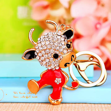 Jeweled Zodiac Cow Keychains in Pink and Red Pictured Colors