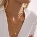 Gold Sunburst Pendant Necklace With Center Shell Bead view 3
