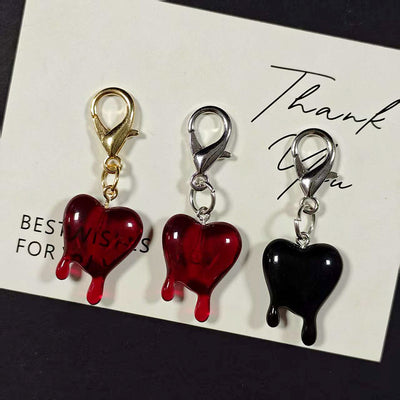 Main product view of dripping Heart Lobster-Clasp Charms in Red and Black Finishes