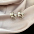 Triple Curve Metal Stud Earrings in Gold and Silver view 7