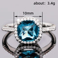 Deep Blue Cushion Solitaire Halo Ring In Polished Silver Tone view 5