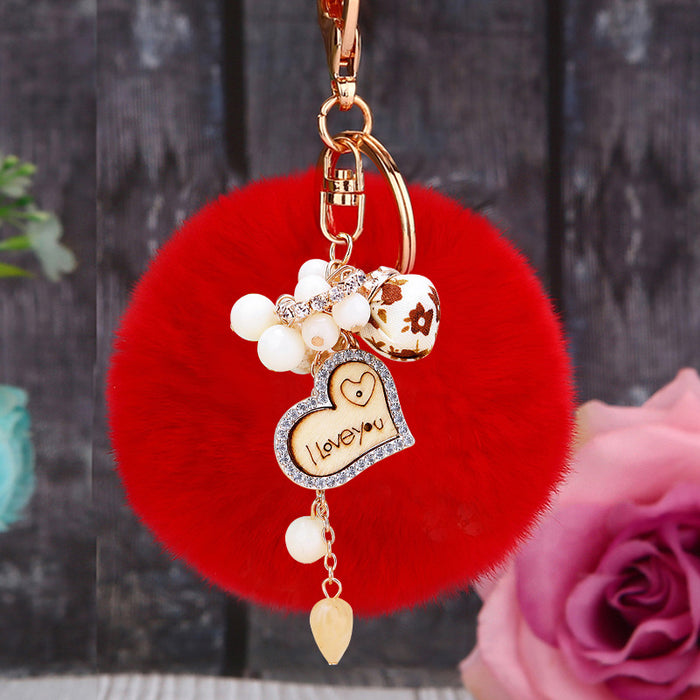 Wooden Love Heart Rabbit Fur Pom Keychains in Fifteen Pictured Fur Colors