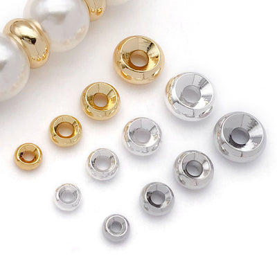 Metal wheel spacer beads in four sizes arranged as a full product overview