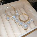 Gold Tone Hoop Earrings with Graduated White Pearls view 1