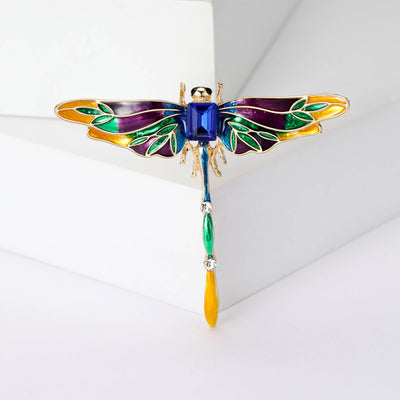Front view of the multicolor enamel dragonfly brooch with gold tone edges brooch and its color options