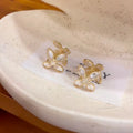Gold Tone Crystal Flower Huggie Earrings with Layered Petals view 4