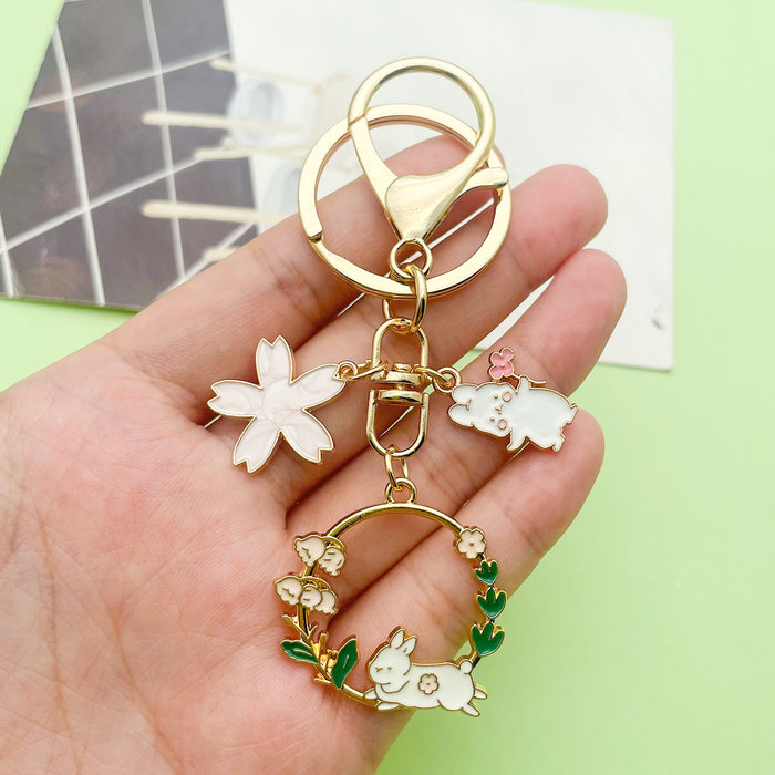 Cat Charm Keychains Featuring White Flower Across 19 Pictured Variations