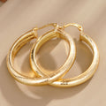 Striped Hoop Earrings in Gold-Tone Metal Jewelry Design view 1