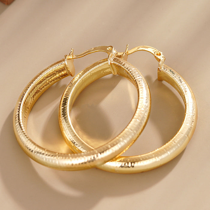 Striped Hoop Earrings in Gold-Tone Metal Jewelry Design