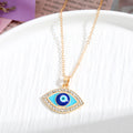 Gold and Silver Tone Crystal Evil Eye Pendant Necklaces in Eight Styles view 3