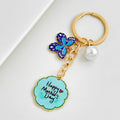 Gold Tone Enamel Flower Butterfly Charm Keychain With Mother's Day Pendant view 4
