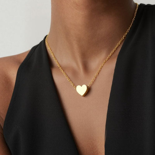 Neckline view of sculpted heart pendant necklaces in main image 1.