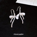Silver Bow Hook Earrings in Polished Statement Design view 4