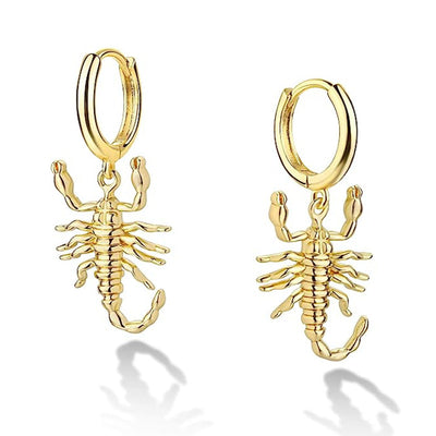 Gold scorpion huggie hoop earrings pair on white background