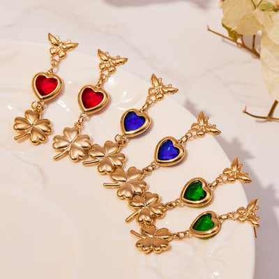 Three color butterfly heart clover drop earring pairs on plate