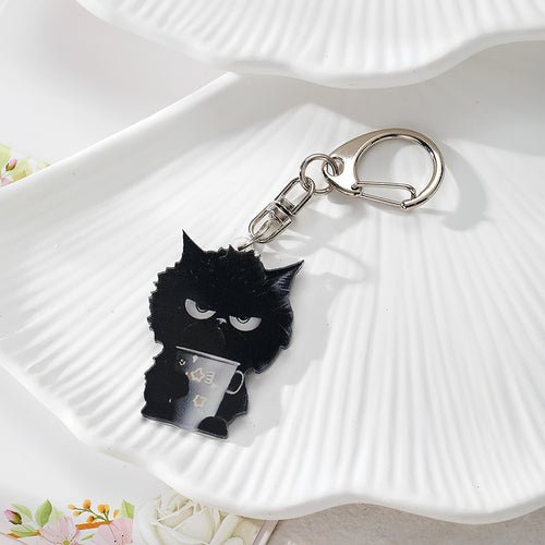 Black grumpy cat acrylic keychain holding a mug with silver clasp