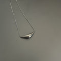 Polished Curved Bar Pendant Necklace in Gold and Silver Tones view 7