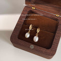 Gold Tone Leaf Top And Oval White Pearl Drop Stud Earrings view 3