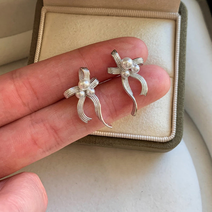 Silver Bow And Pearl Drop Stud Earrings With Curved Ribbons