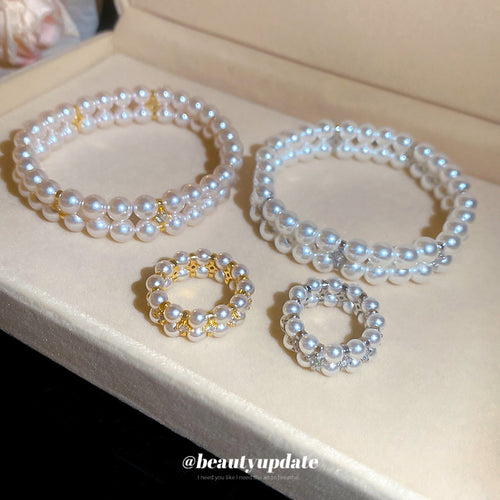 Gold and silver double pearl bracelets with matching pearl rings in cream box