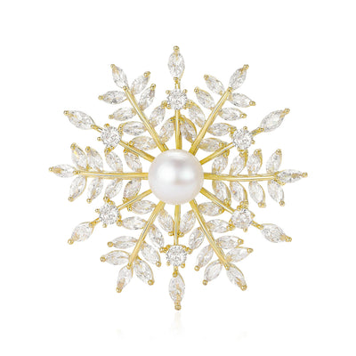 Gold snowflake brooch with pearl center and clear marquise stones