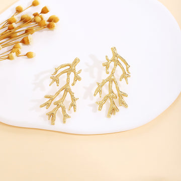 Thirty Gold Tone Sculptural Leaf Heart Shell and Geometric Earrings