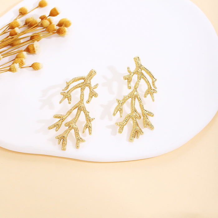 Thirty Gold Tone Sculptural Leaf Heart Shell and Geometric Earrings