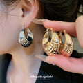Rounded Ribbed Metal Huggie Hoop Earrings in Two Finishes view 1