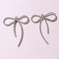 Silver Tone Long-Tail Bow Charm With Textured Outline view 6