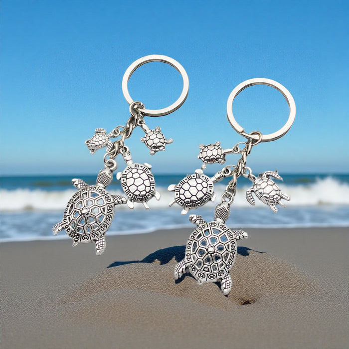 Two Silver Tone Turtle Family Keychain Designs with Metal Hardware