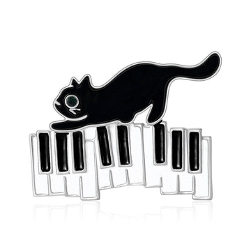 Enamel Cat on Piano Keyboard Brooch Black and White