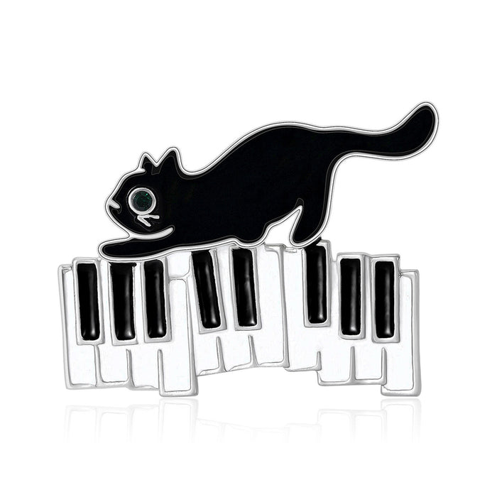 Enamel Cat on Piano Keyboard Brooch Black and White