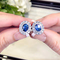Blue Oval Double-Halo Stud Earrings In Silver Tone view 1