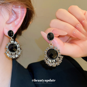 Gold Tone Black Crystal Chandelier Earrings With Floral Halos