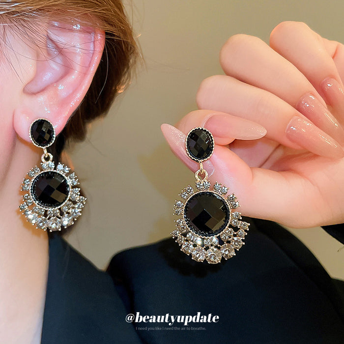 Gold Tone Black Crystal Chandelier Earrings With Floral Halos