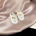 White Oval Floral Inlay Stud Earrings in Gold Tone view 2